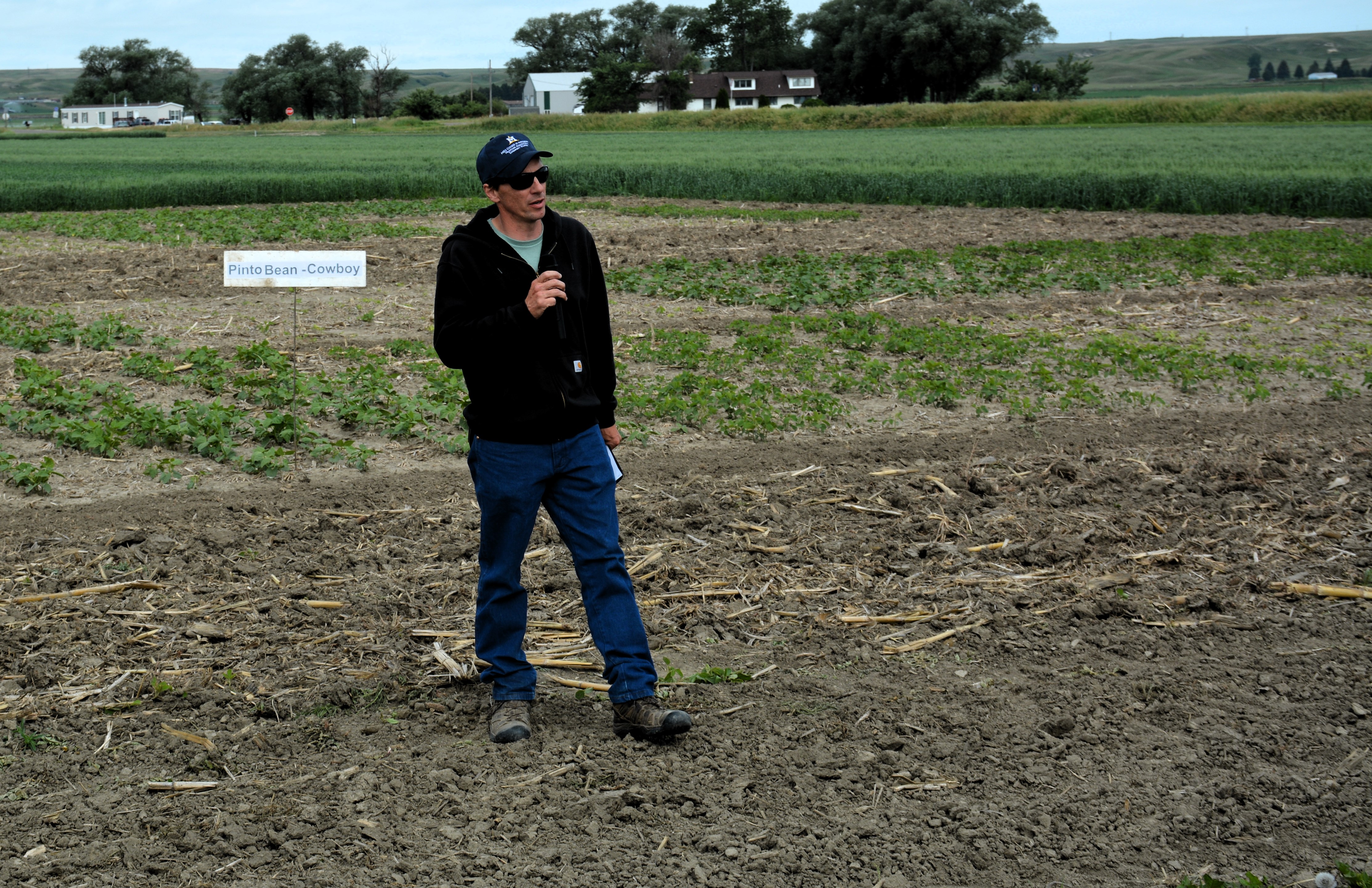 Dr. Bill Franck speaking infront of drybean rotation